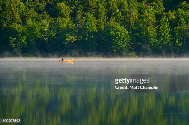 morning canoe ride on adirondack lake - adirondack state park stock pictures, royalty-free photos & images