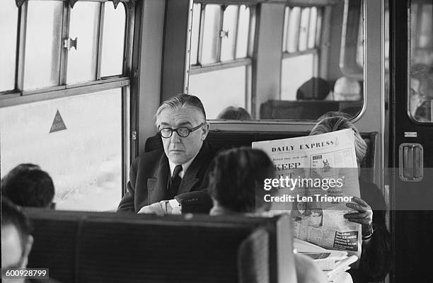 British Labour Party MP Richard Crossman , the Secretary of State for Social Services, in the restaurant car of the Banbury to London train, UK, 9th...