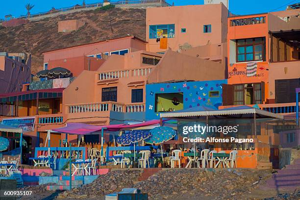 coorfull hotes and resuarants on legzira beach - sidi ifni stock pictures, royalty-free photos & images