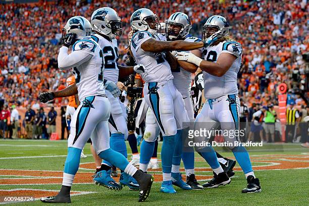 Wide receiver Kelvin Benjamin of the Carolina Panthers celebrates with teammates after scoring on a 14-yard touchdown reception in the first quarter...