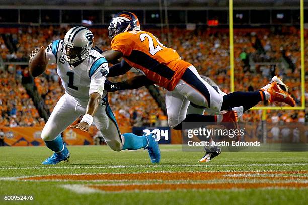 Quarterback Cam Newton of the Carolina Panthers dives into the endzone to score on a two-yard run in the second quarter against free safety Darian...