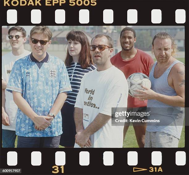 Members of of English rock group New Order with comedian Keith Allen and footballer John Barnes after they recorded the official song of the England...