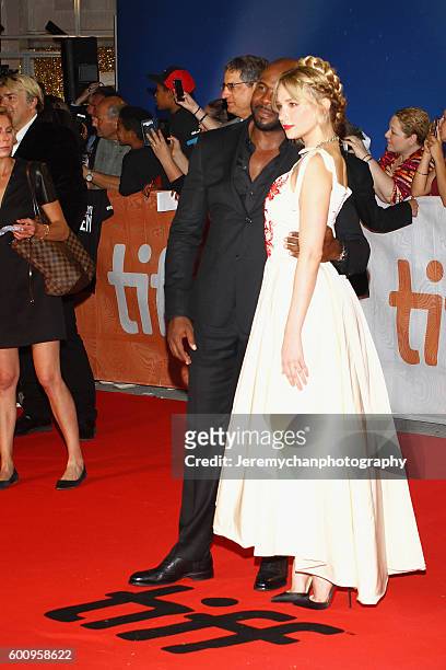 Director Antoine Fuqua and actor Haley Bennett attends the "The Magnificent Seven" premiere held at Roy Thomson Hall during the Toronto International...