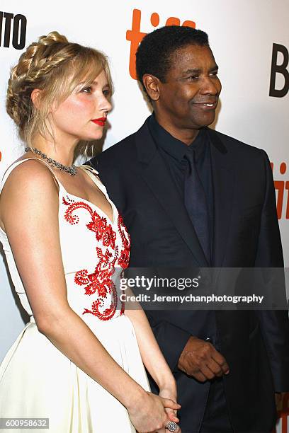 Actor Haley Bennett and actor Denzel Washington attend the "The Magnificent Seven" premiere held at Roy Thomson Hall during the Toronto International...