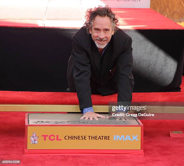 Director Tim Burton attends his Hand And Footprint Ceremony at TCL Chinese 6 Theatres on September 8, 2016 in Hollywood, California.