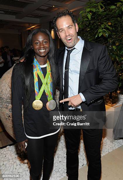 Olympic track and field athlete Tori Bowie and TAO Group managing partner Andrew Goldberg attend the Avra Madison grand opening party on September 8,...