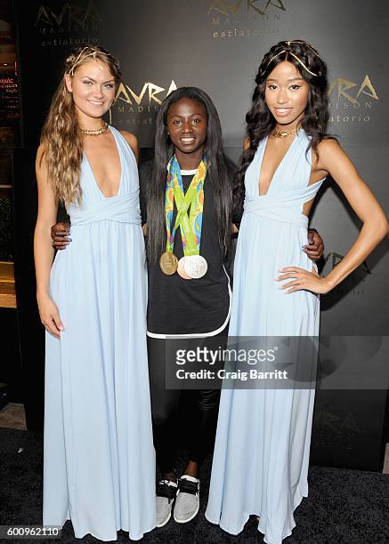 Olympic track and field athlete Tori Bowie and models attend the Avra Madison grand opening party on September 8, 2016 in New York City.