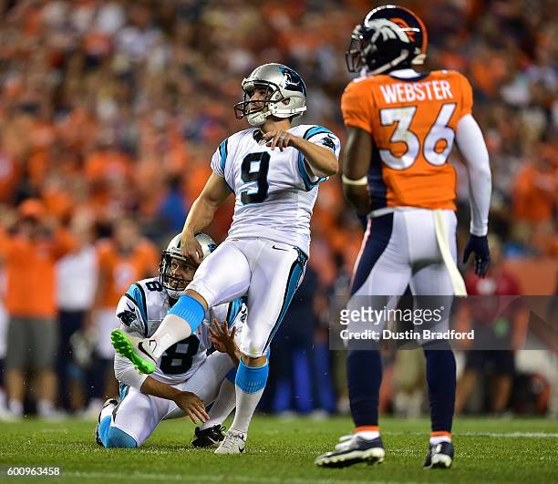 Placekicker Graham Gano and punter Andy Lee of the Carolina Panthers watch as an attempted game-winning field goal misses to lose to the Denver...