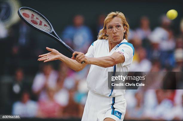 Martina Navratilova of the United States makes a back hand return during the Women's Singles Final match against Steffi Graf at the Wimbledon Lawn...