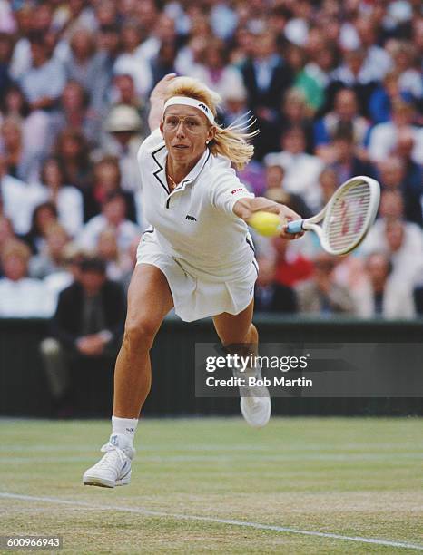 Martina Navratilova of the United States stretches to make a return during the Women's Singles Final match against Steffi Graf at the Wimbledon Lawn...