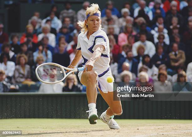 Martina Navratilova of the United States stretches to make a back hand return during the Women's Singles Final match against Zina Garrison at the...