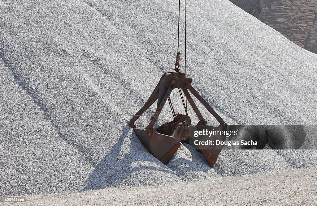 Clamshell Bucket at work in an open pit quarry