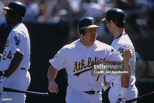Jeremy Giambi of the Oakland Athetics looks on during the game against the Baltimore Orioles at the Network Associates Coliseum in Oakland,...