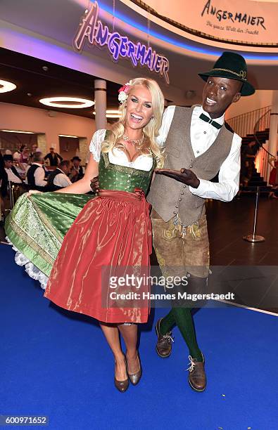 Denise Cotte and Papis Loveday during the Angermaier Kicks Off Oktoberfest Season With 'Trachten-Nacht' on September 8, 2016 in Munich, Germany.