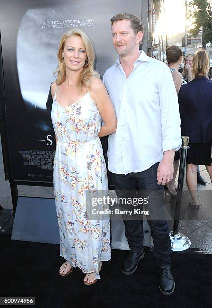 Actress Alison Eastwood and husband sculptor Stacy Poitras attend the Los Angeles industry screening of Warner Bros. Pictures' 'Sully' at Directors...