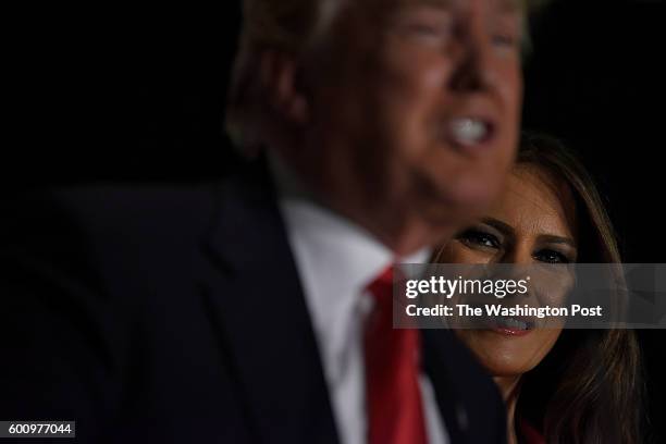 Presidential candidate Donald Trump stands with his wife Melania before he holds a campaign rally at the U.S Cellular center on February 1, 2016 in...