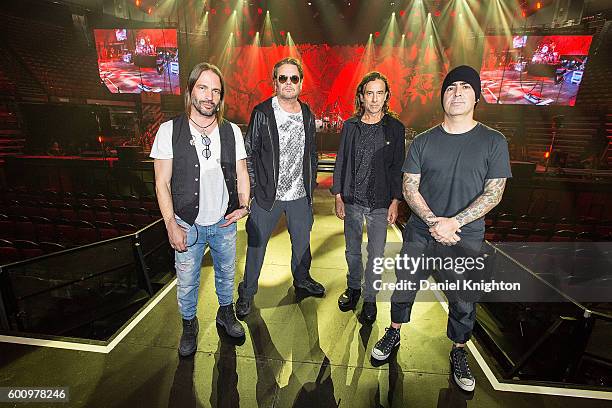 Musicians Sergio Vallin, Fher Olvera, Juan Calleros, and Alex Gonzalez of Mana pose on stage during their final dress rehearsal for the Latino Power...