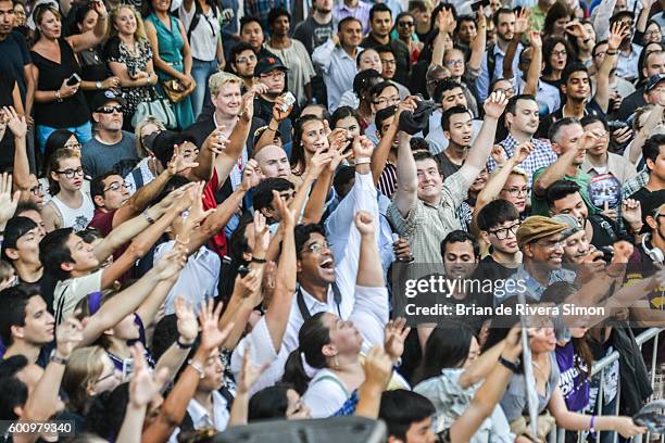 Fans reaching for the free t-shirt at 'The Magnificent Seven' premiere during the 2016 Toronto International Film Festival at Roy Thomson Hall on...