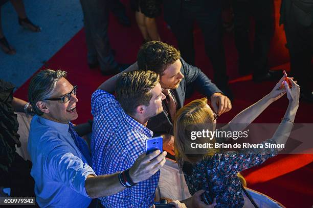 Actor Chris Pratt takes selfies with fans at 'The Magnificent Seven' premiere during the 2016 Toronto International Film Festival at Roy Thomson Hall...