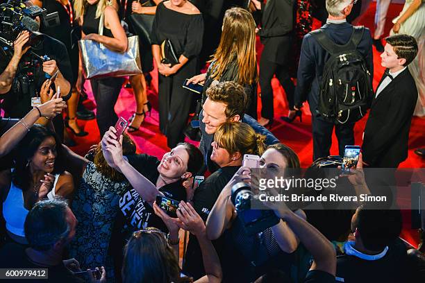 Actor Chris Pratt takes a selfie with fans at 'The Magnificent Seven' premiere during the 2016 Toronto International Film Festival at Roy Thomson...
