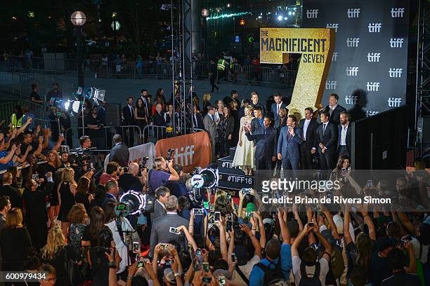 Fans and photographer crowd around to take a group photo with cast of 'The Magnificent Seven' premiere during the 2016 Toronto International Film...