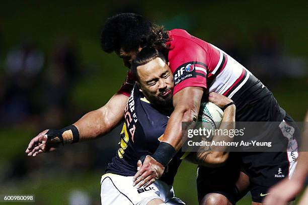 Matt Proctor of Wellington runs into a tackle from So'otala Fa'aso'o of Counties Manukau during the round four Mitre 10 Cup match between Counties...