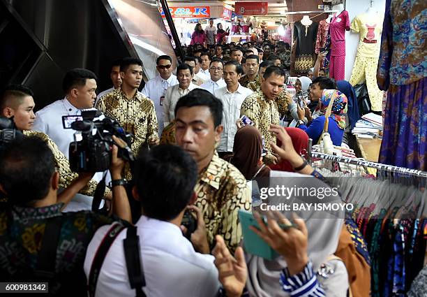 Indonesian President Joko Widodo and Philippine President Rodrigo Duterte visit Tanah Abang market in Jakarta on September 9, 2016. American...