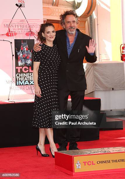 Actress Winona Ryder and Director Tim Burton attend the hand and footprint ceremony for Tim Burton at The TCL Chinese Theatre on September 8, 2016 in...