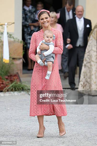 Crown Princess Victoria of Sweden with her son Prince Oscar attend the christening of Prince Alexander of Sweden at Drottningholm Palace Chapel on...