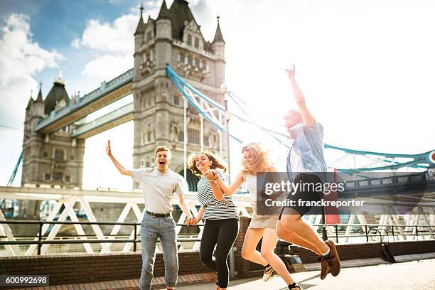 group of people jumping in london - english culture stock pictures, royalty-free photos & images