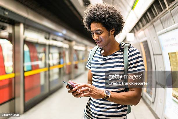 solo traveler on a london station - london street stockfoto's en -beelden