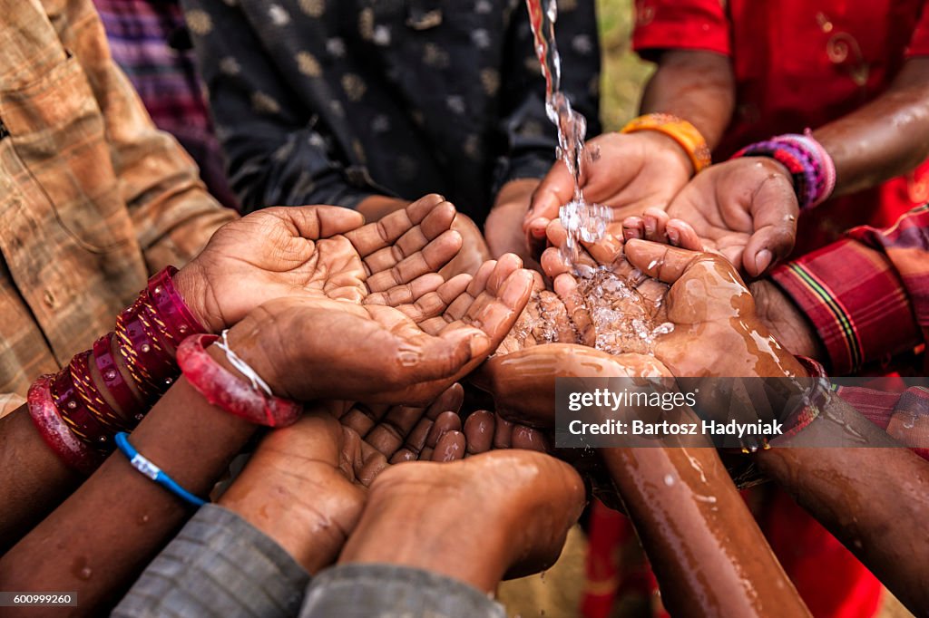 Hands of poor - African children asking for drinking water