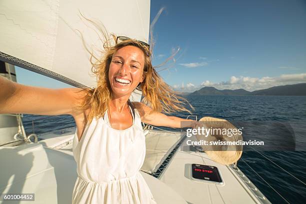 selfie portrait of blond girl on sailing boat - whitsundays stock pictures, royalty-free photos & images