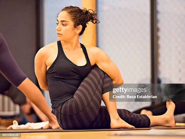 yoga student in marichyasana - spinal twist stock pictures, royalty-free photos & images