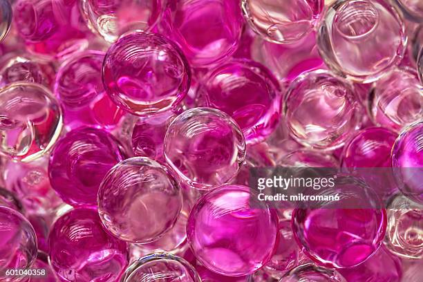 pink sparkling pearls background - pink pearls stock-fotos und bilder