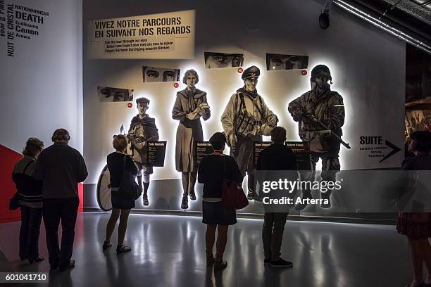 Tourists visiting the Bastogne War Museum devoted to the Second World War Two Battle of the Bulge in the Belgian Ardennes, Belgium.