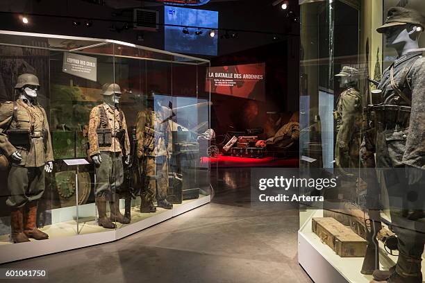 German soldier's weapons and uniforms in the Bastogne War Museum devoted to the Second World War Two Battle of the Bulge in the Belgian Ardennes,...