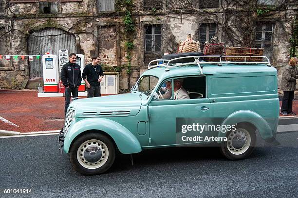 Classic car Renault Dauphinoise with suitcases on luggage carrier during the Embouteillage de la Route Nationale 7, happening for oldtimer cars from...