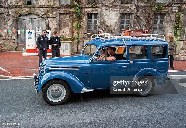 Classic car Renault Dauphinoise with suitcase on luggage carrier during the Embouteillage de la Route Nationale 7, happening for oldtimer cars from...