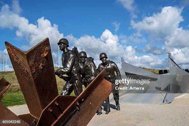 Czech hedgehog and landing craft in front of the Musee du Debarquement Utah Beach, World War Two museum at Sainte-Marie-du-Mont, Normandy, France.