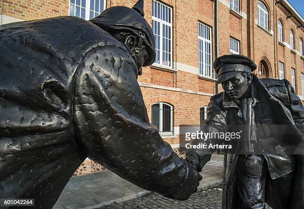 Statue by Andrew Edwards representing British and German soldiers shaking hands during World War One Christmas Truce on the Mesen / Messines market...