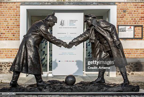 Statue by Andrew Edwards representing British and German soldiers shaking hands during World War One Christmas Truce in front of the Mesen / Messines...