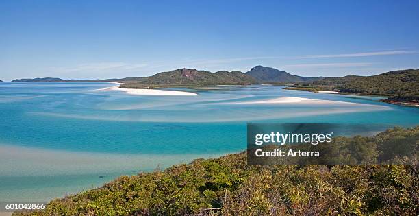 Areal view of white sandy beaches and turquoise blue water in the bay of Whitehaven Beach on Whitsunday Island in the Coral Sea, Queensland,...