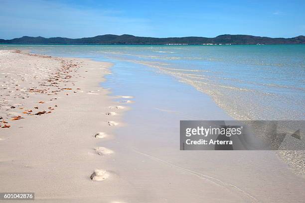 White sandy shoreline of Whitehaven Beach on Whitsunday Island in the Coral Sea, Queensland, Australia.