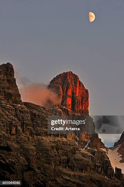 Alpenglow at sunset over the mountain Monte Cristallo in the Dolomites, Italy.