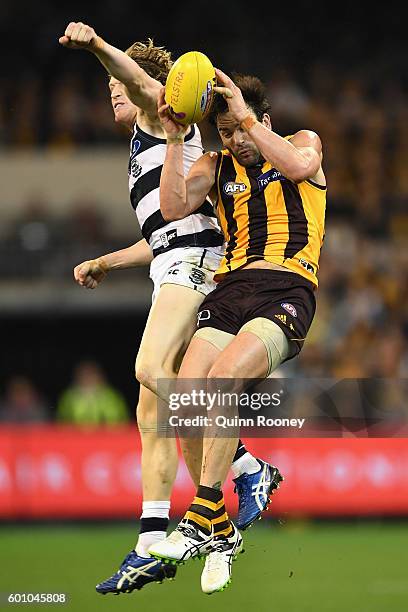 Jordan Lewis of the Hawks marks infront of Josh Caddy of the Cats during the 2nd AFL Qualifying Final match between the Geelong Cats and the Hawthorn...