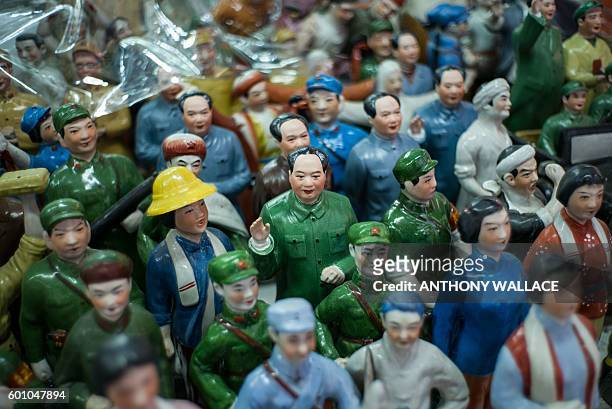 Miniature statue of Mao Zedong is displayed with statues of Red Guards at a stall in Hong Kong on September 9 which marks 40 years since Mao's death...