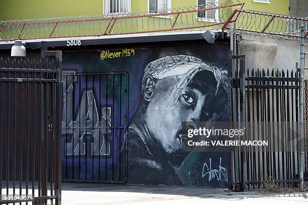 Wall dedicated to the memory of US rapper Tupac Shakur is seen on May 26, 2016 in Los Angeles, California. Twenty years after his death, Tupac still...