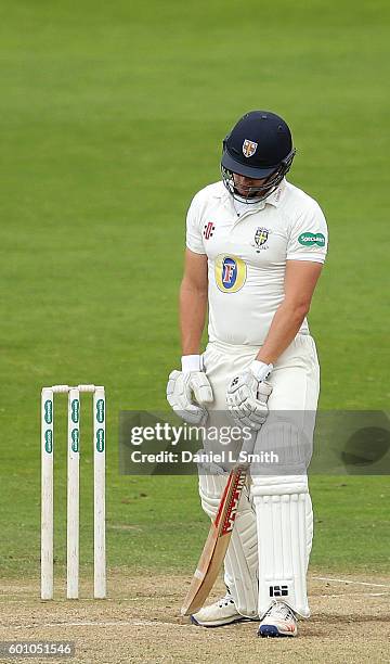 Barry McCarthy of Durham stands at the stumps dejected after being caught by Adam Lythe of Yorkshire during Day Four of the Specsavers County...