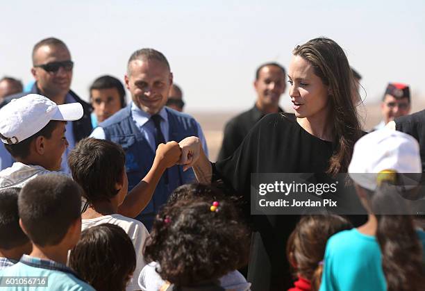 Actress and UNHCR special envoy and Goodwill Ambassador Angelina Jolie greets children during a press conference at Al- Azraq camp for Syrian...